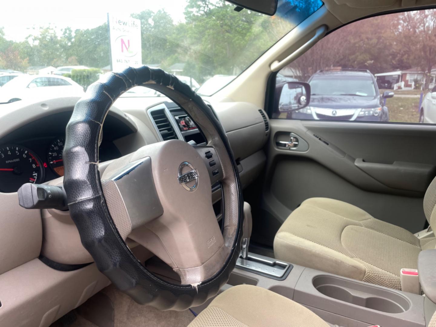 2009 BLACK NISSAN FRONTIER CREW CAB SE (1N6AD07U09C) with an 4.0L engine, Automatic transmission, located at 5103 Dorchester Rd., Charleston, SC, 29418-5607, (843) 767-1122, 36.245171, -115.228050 - Local Trade-in with CD/AUX/Bluetooth, Power Windows, Power Locks, Power Mirrors, Keyless Entry, Alloy Wheels, Bedliner, Tow Package. Clean CarFax (no accidents reported!) 209k miles Located at New Life Auto Sales! 2023 WINNER for Post & Courier's Charleston's Choice Pre-owned Car Dealer AND 2018-2 - Photo#17